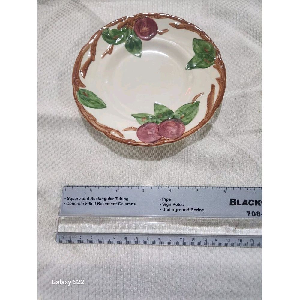 Franciscan Red Apple set, featuring round ceramic plates with a glossy finish...
